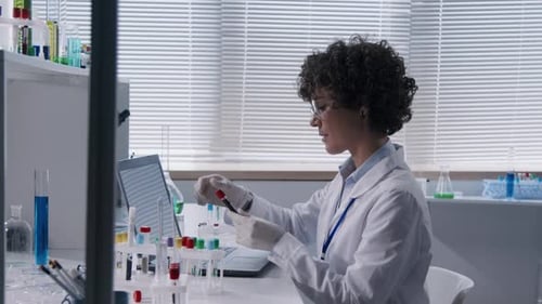 Researcher Working with Samples in Test Tubes