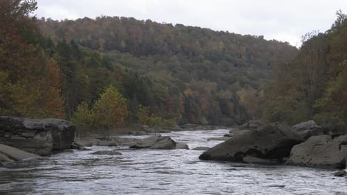 Hand-held shot of the river Gorge flowing peacefully through the scenery