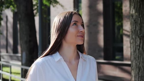 Young Woman with Long Hair Outdoors Portrait