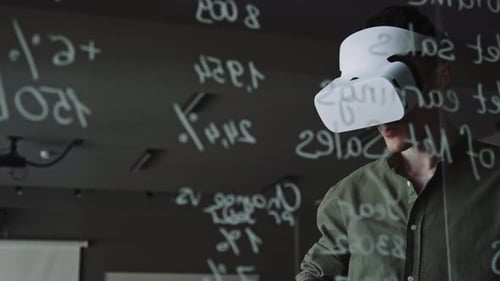 Man in VR Headset Using Remote Controller and Testing New App in Office