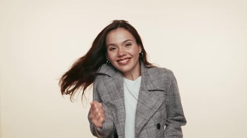Young Woman Enjoying Dance Expressing Happiness in Casual Outfit
