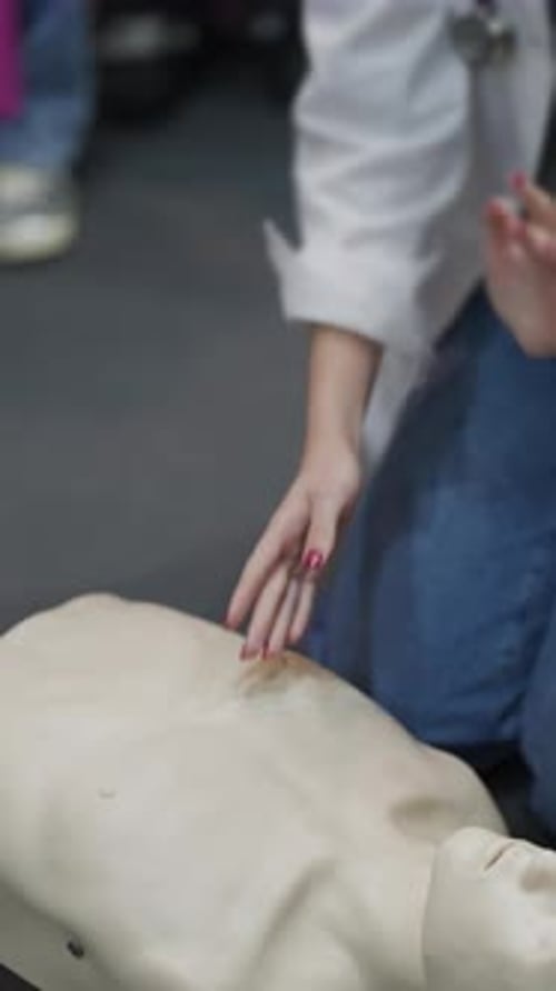 Medical Student Practicing Cpr on a Mannequin