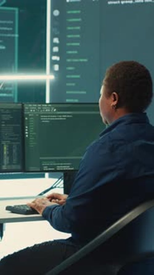 Woman Working at Computer in Bright Tech Office