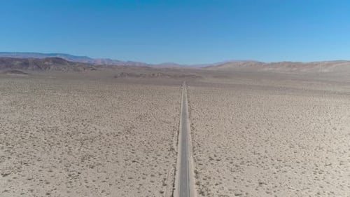 DJI Phantom 4 pro in the desert of southern California on an open road in between mountains