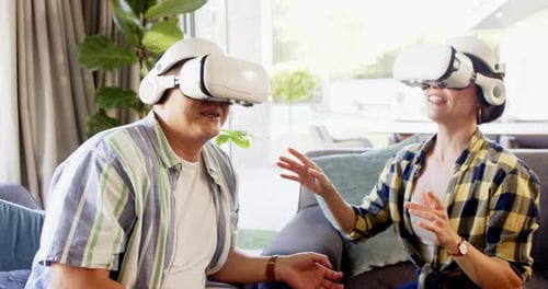 Couple Experiencing Virtual Reality Together Indoors