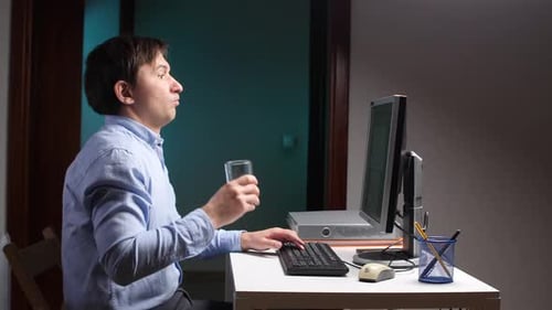 Office Worker Spitting Water on Computer Screen While Drinking