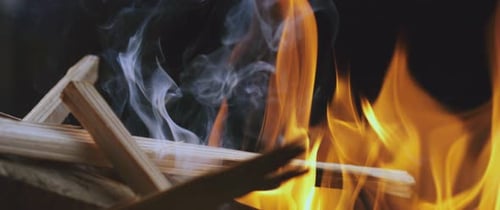Campfire Flames Burning Brightly with Rising Smoke
