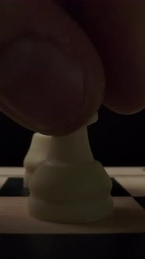 Vertical of The First Standard Move By White Chess Pawn on Checker Board