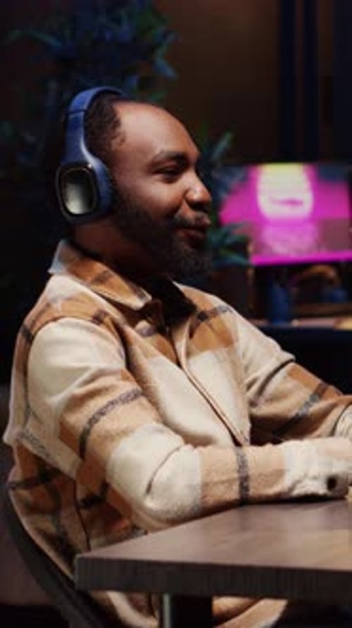 Vertical Video Man Hosting Podcast Using Professional Audio Equipment to Ensure High Sound Quality