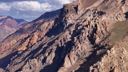 Enormous Mountain Vista Featuring Rugged Terrain and Majestic Landscapes Under a Cloudy Sky