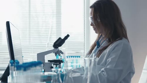 In a Dedicated and Wellequipped Laboratory Setting a Scientist is Diligently Analyzing Various