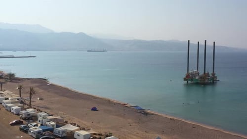 HaDatiyim Beach Line With Many Camping Cars Parked in Eilat city, Aerial View of Offshore Self-eleva