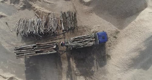 Woodworking Recycling of Tree Trunks Into Splinters Unloading Logs From a Truck Wood Processing