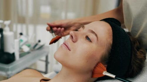 Woman Receiving a Luxurious Spa Facial Treatment
