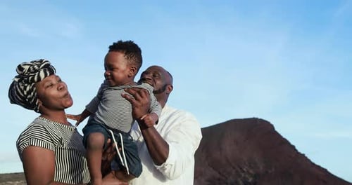 Cheerful African Family Beach Fun