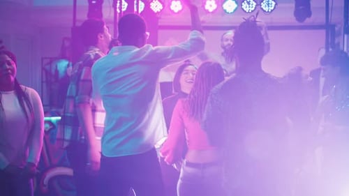 Young Adults Dancing Together at Lively Party