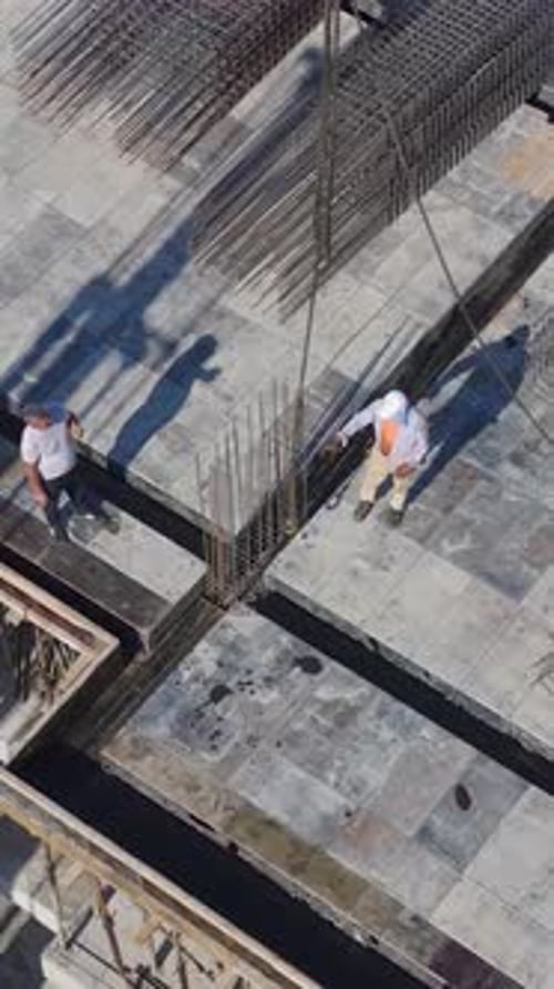 Construction Workers Assembling Steel Frames Aerial Shot