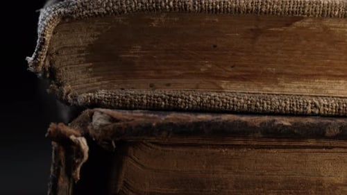 Stack of Old Antique Books in Dark Light