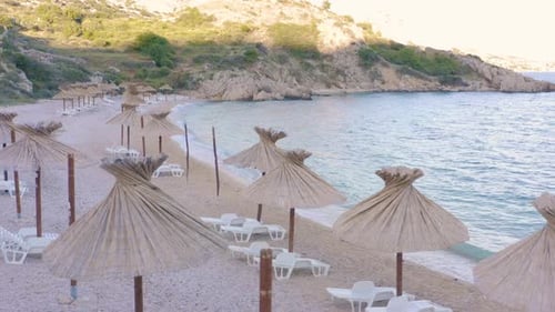 Parasols And White Sun Loungers In A Lovely Beach In Krk Island, Croatia - Perfect Summer Destinatio