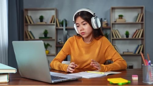 Student Learning Online at Home With Laptop