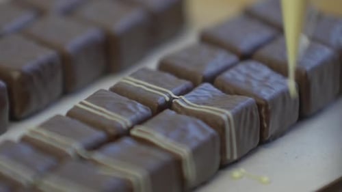 decorating chocolates with white garnish