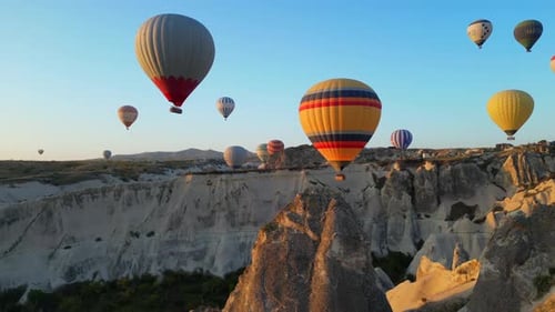 Colorful Hot Air Balloons Floating Over Cappadocia Landscape