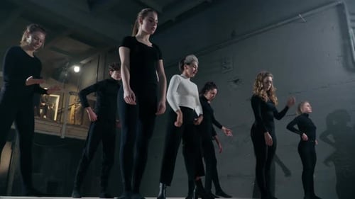 Dance Instructor Guiding Group in Modern Dance