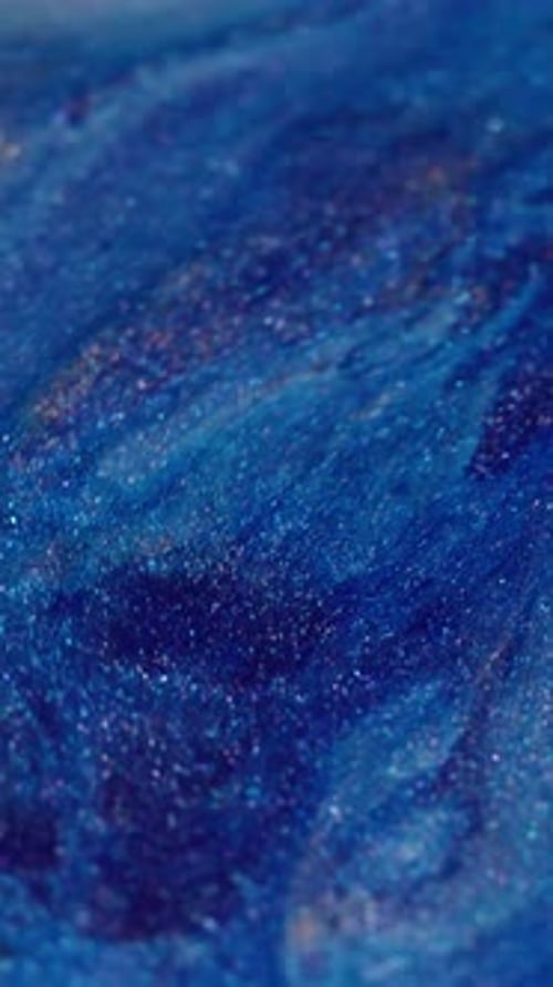 Abstract blue fluid background with glitter and waves