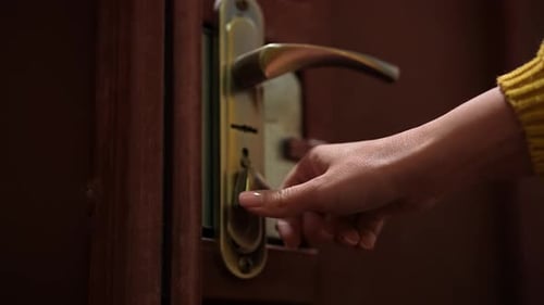 Hand Turning Key in Vintage Brass Door Lock