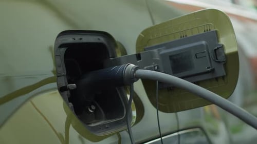 Closeup of Zero Emission EV Vehicle Connected to Charging Dock