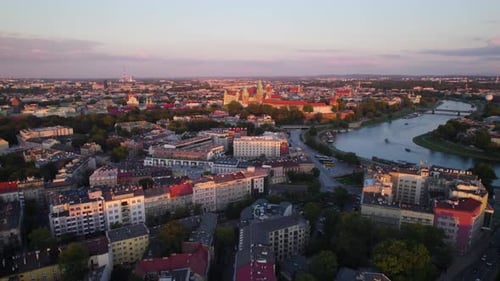 Old Town Krakow With Wawel Royal Castle In Poland At Sunrise - aerial drone shot