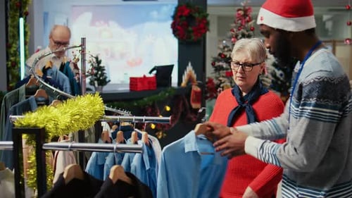 Employee Assisting Older Client in Store