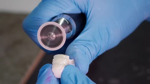 Dental Crown Being Polished by Technician