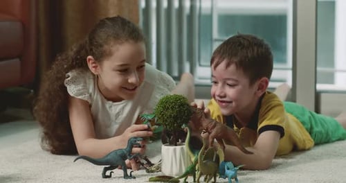 Happy Little Kids Explain Paleontology Having Fun at Home Together