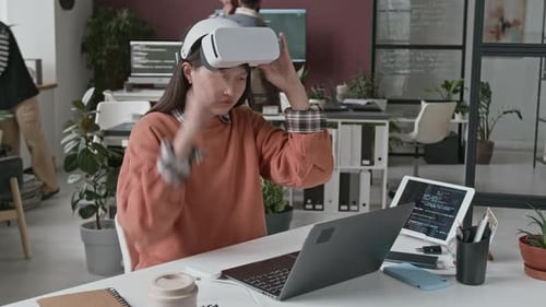 Young Female Programmer Working on VR Application at IT Startup
