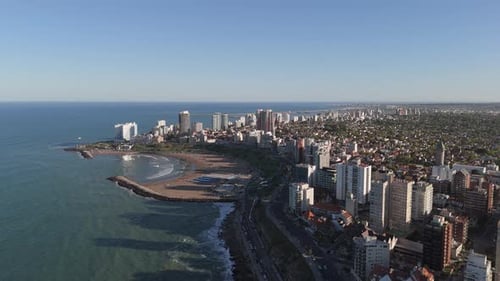 Aerial View of Mar del Plata Skyline and Coastline at Sunset. Vibrant Urban and Beach Destination.