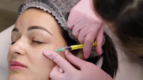 Woman Receives a Cosmetic Injection on Her Face