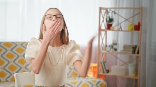 Young Person Blowing a Kiss in Room