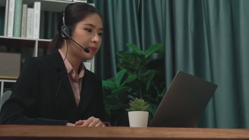 Woman with Headset Talking During Online Meeting