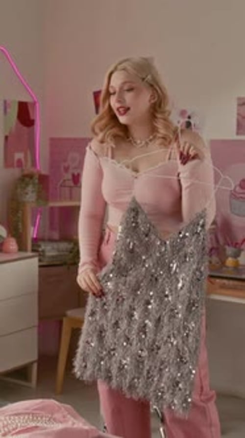 Blonde Woman Recording Video of Dress at Home