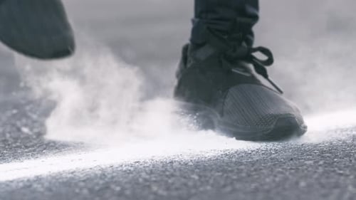 Athletic Shoes Stepping Over the Line