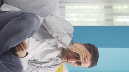 Vertical video of Fear reaction of man looking at camera. Coward man.