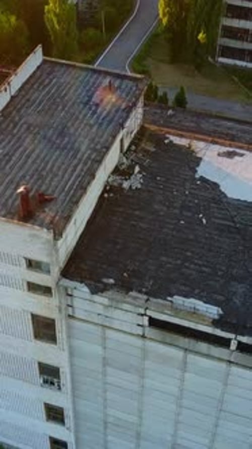 Abandoned Old Buildings. Aerial view of the ruins of an old abandoned factory near farmland.