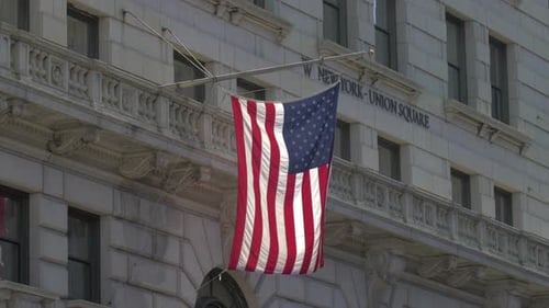 American Flag Waving on a City Building
