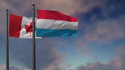 Waving Flags of Canada and Luxembourg with Cloudy Sky