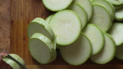 Sliced Zucchini on Wooden Cutting Board