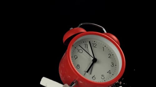 Alarm Clock and School Crayons Fly Up on a Black Background Filmed on a Highspeed Camera at 1000 Fps
