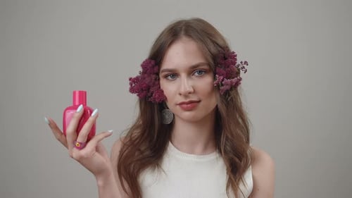 Woman with Flowers and Beauty Product Posing