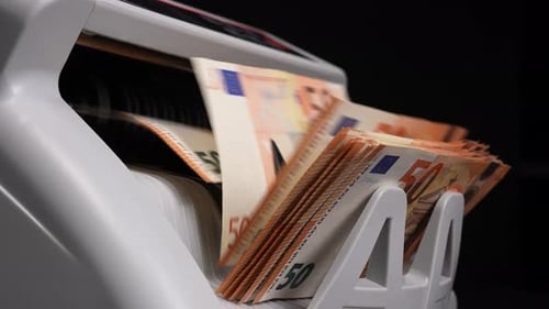 Machine Counting Fifty Euro Notes in Close Up