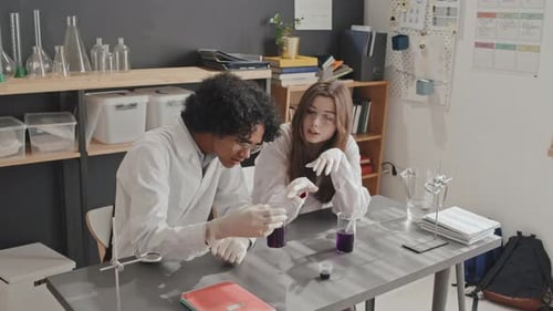 Students Conducting Science Experiment in Classroom